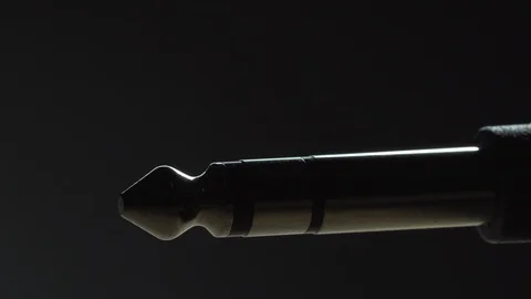 Guitar plug dramatic lighting isolated close up Stock Footage 119120088