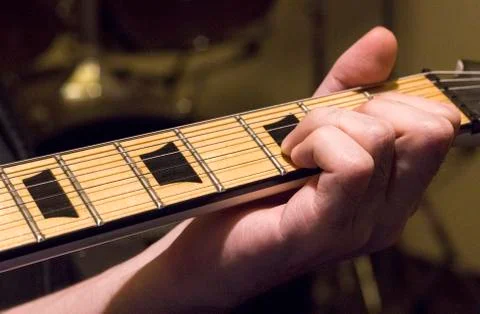 Guitar practice under the dim light Foto stock