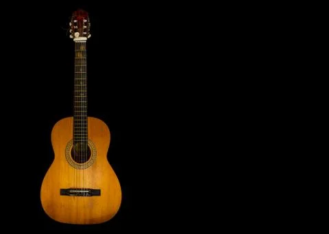 Guitar with six strings on black background Stock Photos