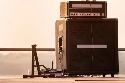 Guitar stand with amplifier system. Stock Photos
