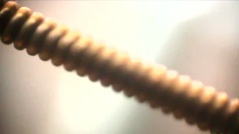 A guitar string, a clock, coffee, and a pen captured in macro Видео 333706615