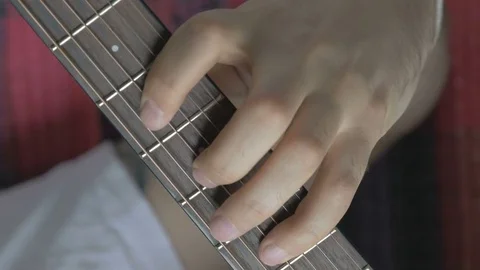 Guitar strings closeup. A man plays gitare Stock Footage 73977096
