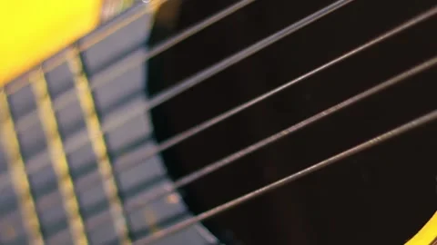 Guitar strings vibrating close up super slow motion shot selective focus 库存影片 320564338