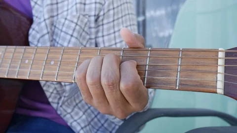 Guitar strumming Stock Footage 113767566