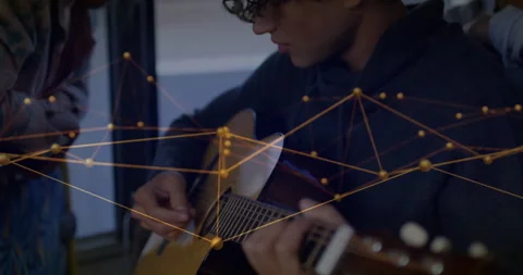 Guitar strumming sparking pullback, man adjusting frets as women guiding under Vídeos de archivo 314408682