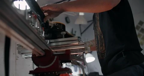 Guitar tech mounts the electric guitar on the jig at the musical instruments Video stock 166166578