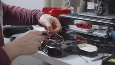 Guitar tech solders the electronics, repair of the musical instruments at the Stock Footage 279655752