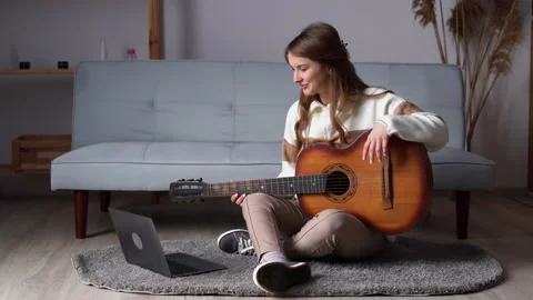 Guitar tutorial with laptop. Music course. Technology and leisure. Teacher 動画素材 233186148