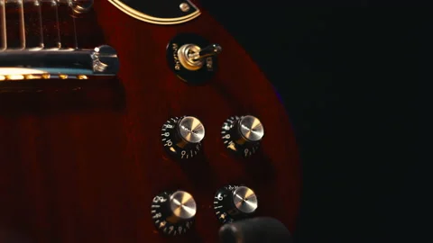 Guitar volume and tone knobs on an SG Model, sliding right to left. [4K] 動画素材 152582394