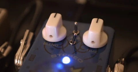 Guitarist Adjusting Knobs And Switches On Guitar Effect Pedal 스톡 동영상 114635540