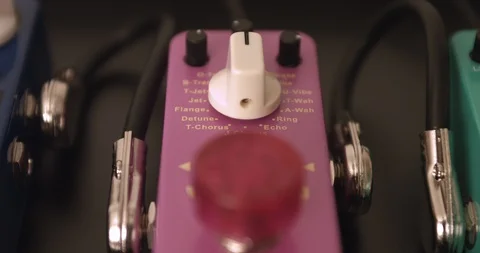 Guitarist Adjusting Knobs And Switches On Modulation Guitar Effect Pedal Video stock 114637638