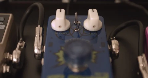 Guitarist Adjusting Knobs And Switches On Reverb Guitar Effect Pedal Video stock 114638335