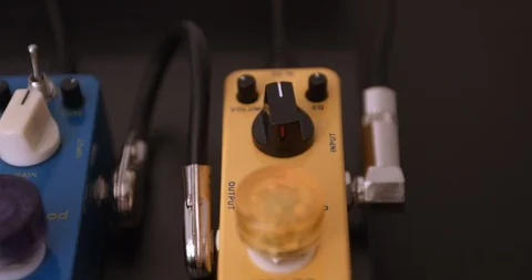 Guitarist Adjusting Knobs And Switches On Guitar Effect Pedals. Dolly Shot. 스톡 동영상 114641973