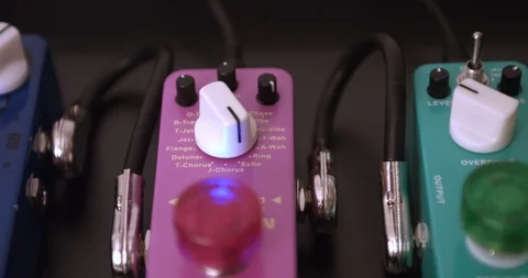 Guitarist Adjusting Knobs And Switches On Guitar Effect Pedals. Dolly Shot. 스톡 동영상 114642544