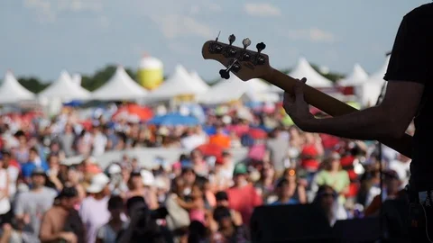 Guitarist performs in front of crowd Video stock 118490248