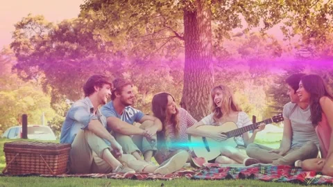 Guitarist picking up guitar, strumming while six friends turning, laughing, Stock Footage 330713608