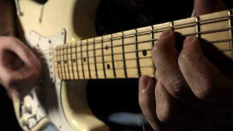Guitarist playing an electric guitar: close-up footage Stock Footage