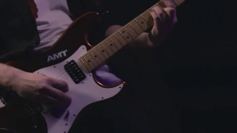 Guitarist plays electric guitar close-up Stock Footage