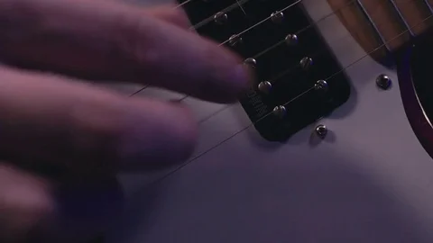 Guitarist plays on electric guitar close-up Stock Footage