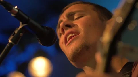 Guitarist Singing Low Angle Hand-Held Stock Footage 47295891
