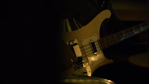 Guitarist using laptop while holding guitar in hand Stock Footage 108922711