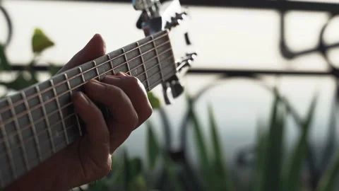 Guitarist's Fingers soloing on guitar outdoors closeup Stock Footage