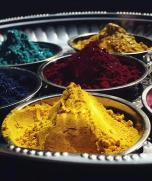 Gulal or Abir is powdered colour that people use on Holi Stock Photos