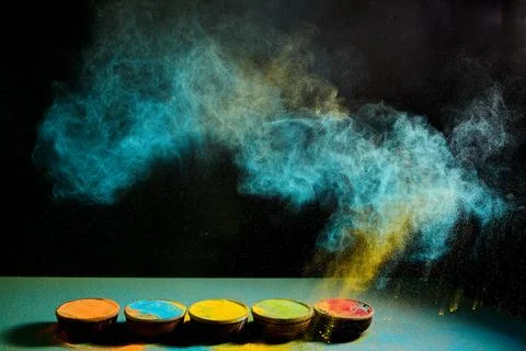 Gulal powder exploding in vibrant festive colors Stock Photos