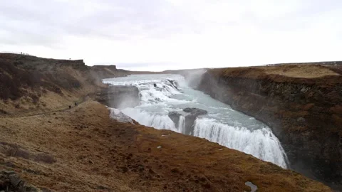 Gullfoss waterfall cascading down a rugged canyon along the River Hvita on a Stock Footage 339303782