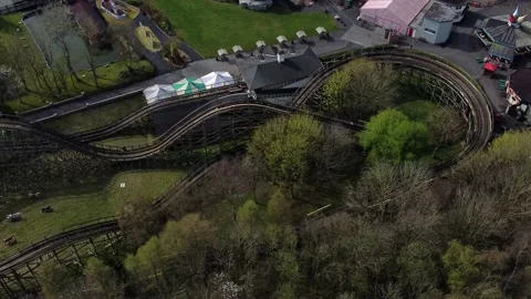 Gulliver's world Warrington rollercoaster theme park aerial view watching Stock Footage 151472650