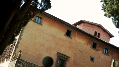 Gulls fly around old stone church Stock Footage 69167872