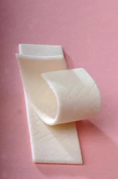 Gum chewing on a pink background Stock Photos