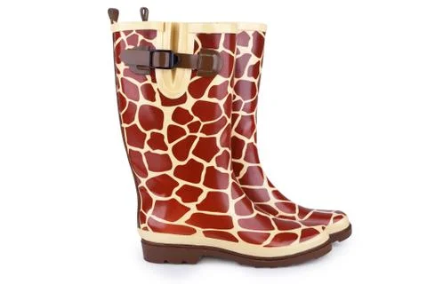 Gumboots with giraffe pattern isolated on white Stock Photos