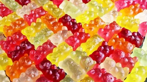 Gummy bear background. Gummy bears as texture. Gum bear candy colorful pattern. 動画素材 96368548