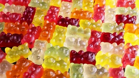 Gummy bear background. Gummy bears as texture. Gum bear candy colorful pattern. 動画素材 96544661