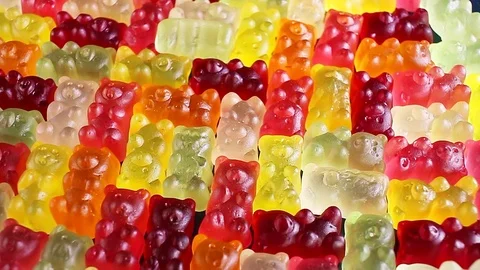 Gummy bear background. Gummy bears as texture. Gum bear candy colorful pattern. 動画素材 97163732