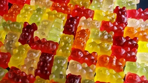 Gummy bear background. Gummy bears as texture. Gum bear candy colorful pattern. Video stock 102743629
