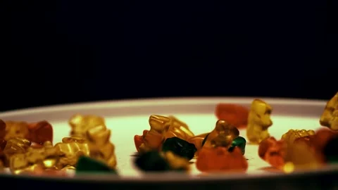 Gummy Bears Fall on Plate in Slow Motion Stock Footage 300890463