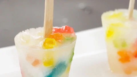 Gummy Soft Drink Popsicles With Scissors Stock Footage 87771574