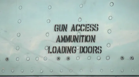 Gun ammunition door label stenciled on the side of a jet fighter Stock Footage 39830935