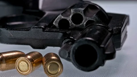 A gun with ammunition on white background Stock Footage