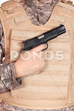 Gun and bullet proof vest.JPG Stock Photos