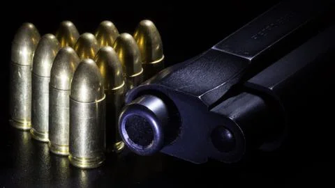Gun and bullets Stock Photos