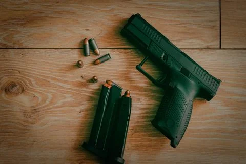 Gun and bullets Stock Photos