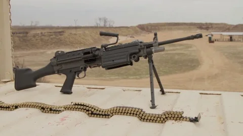 Gun and bullets on table right to left slider shot Video stock 76940349