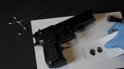 Gun and finger prints Stock Footage 79381408