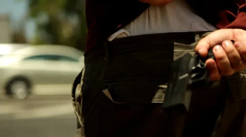 Gun at back Vídeos de archivo 27193159