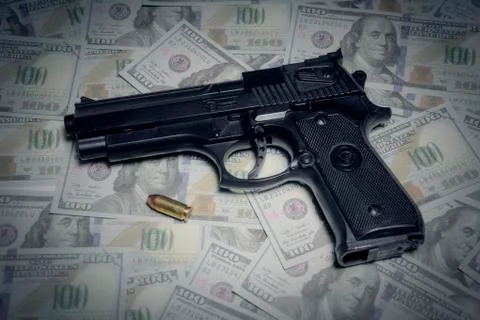 Gun bullet dollars composition Stock Photos