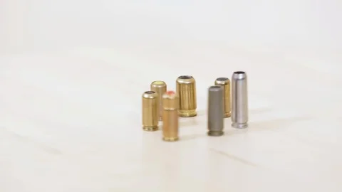 Gun bullets on a metal background Stock Footage 97617029