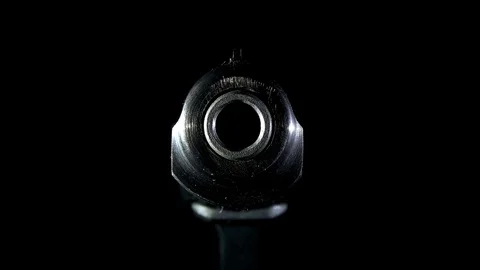 The gun comes out of the dark,closeup Stock-Footage 82805235